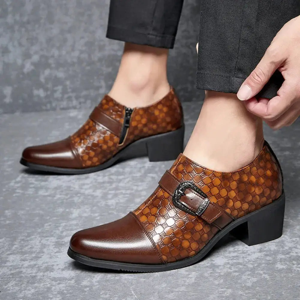 Men’s brown leather dress shoes featuring a crocodile skin pattern and a black Cuban style buckle