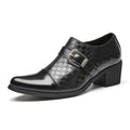 Black leather men’s dress shoe with textured crocodile pattern and silver-toned Cuban buckle fastener