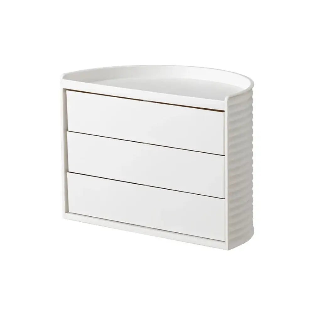 White glossy corner dresser with three drawers and ribbed side panel for 360 rotating white tiered makeup organizer