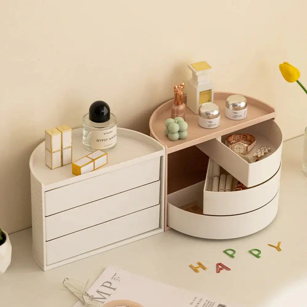 White round vanity organizer with three tiered drawers and a 360 rotating top compartment for jewelry and cosmetics