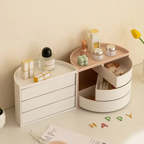 White round vanity organizer with three tiered drawers and 360 rotating top compartment for jewelry and cosmetics