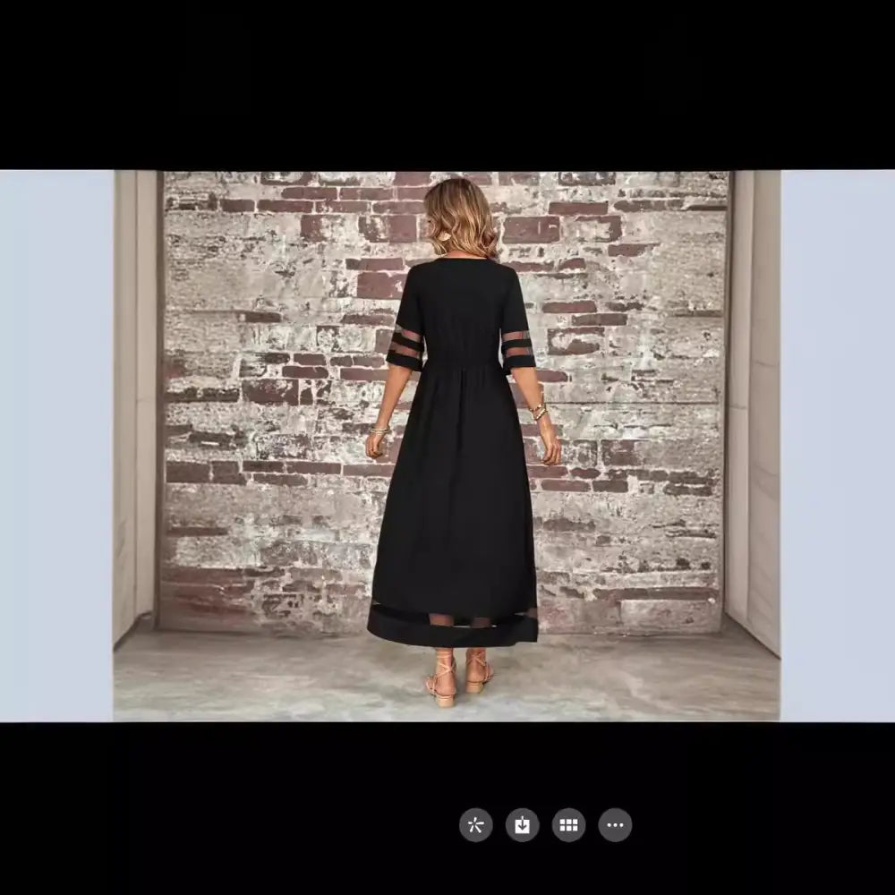Black midi mesh patchwork maxi dress with sheer mesh panels at three quarter sleeves and hemline with pockets