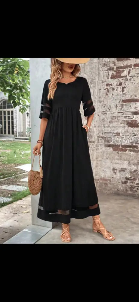 Black midi mesh patchwork maxi dress with sheer mesh panels at sleeves and hem featuring a relaxed fit and pockets