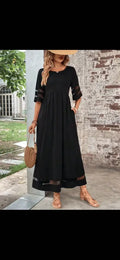 Black midi mesh patchwork maxi dress with sheer mesh panels at sleeves and hem featuring a relaxed fit and pockets