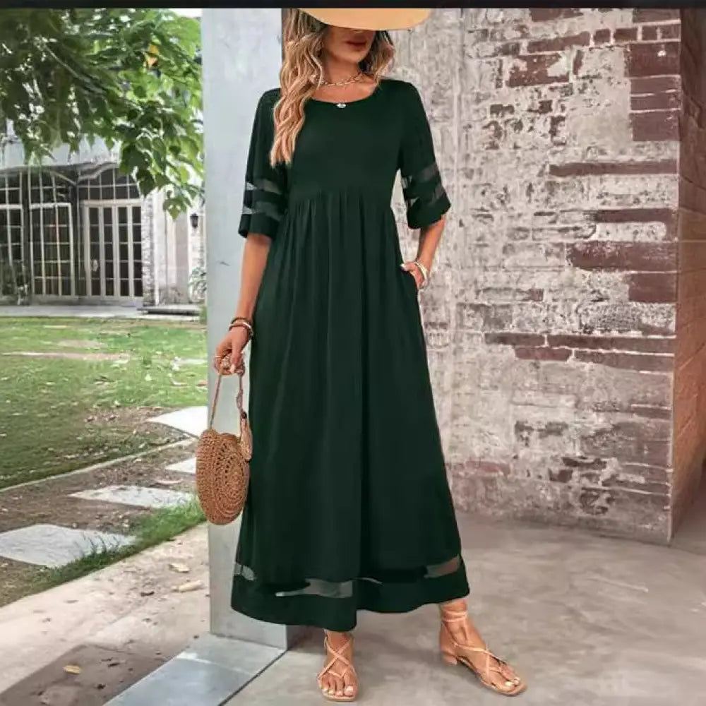 Dark green mesh patchwork maxi dress with sheer mesh panels at cuffs and hem and three-quarter sleeves