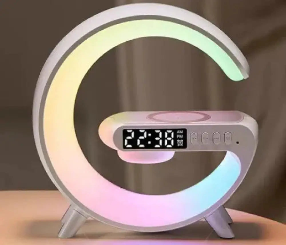 A sleek modern c-shaped g-shaped led lamp with rainbow ring bluetooth speaker wireless charger and digital clock display