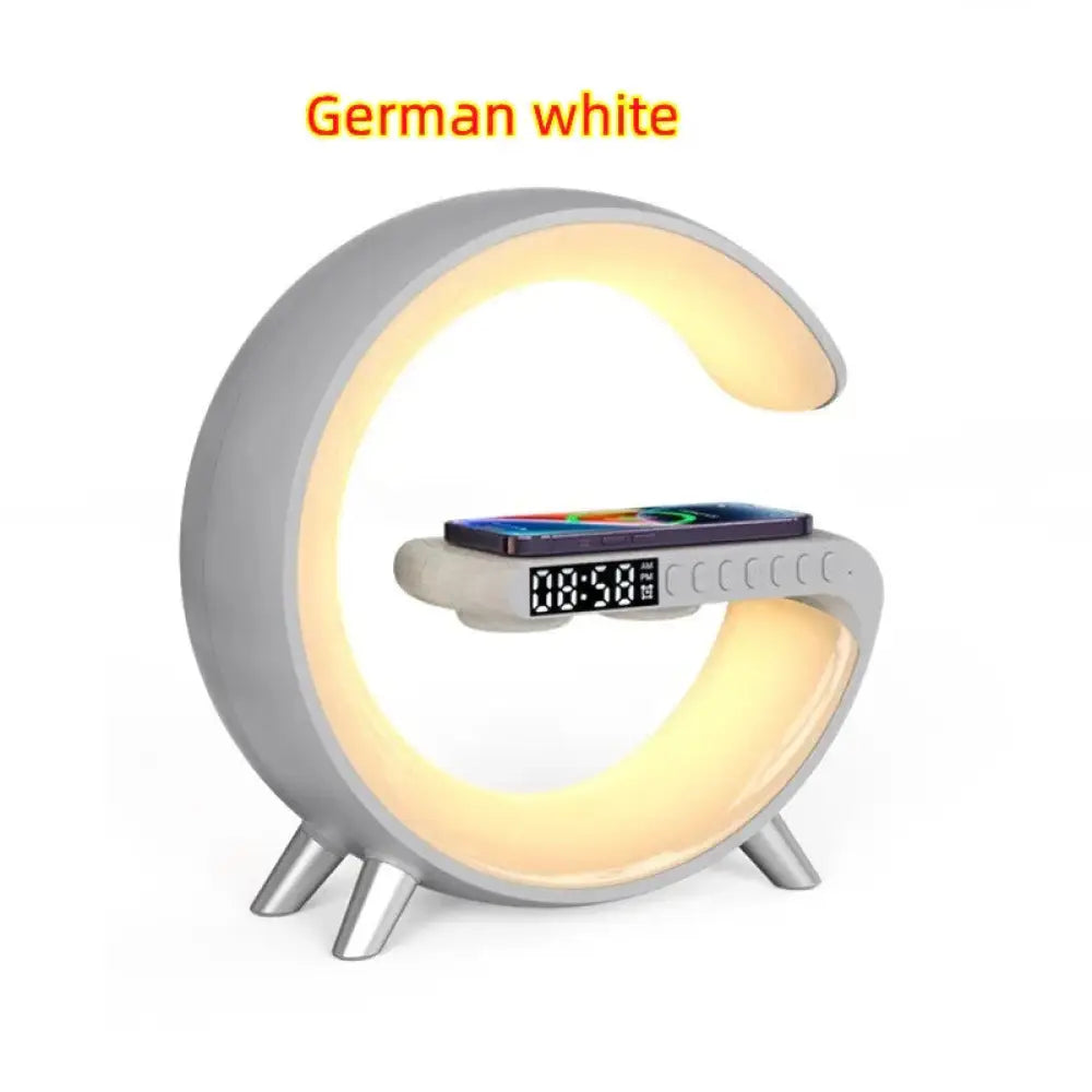 G-shape smart ambient light is a german white crescent-shaped lamp with integrated led lighting digital display bluetooth speaker and charger