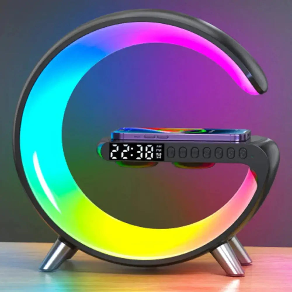 G-shaped black LED lamp with vibrant rainbow glow, integrated digital clock, Bluetooth speaker, and wireless charger