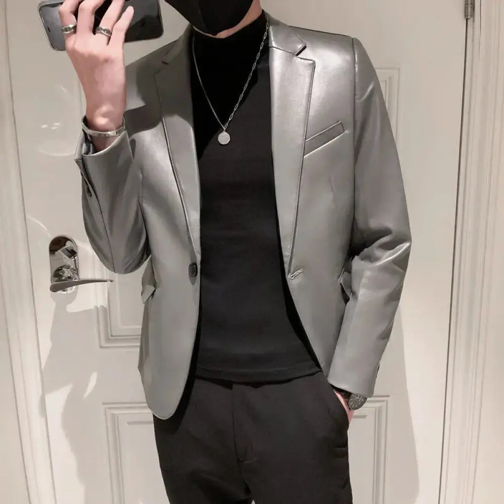 A sleek silver faux leather men’s slim fit korean polo collar blazer with a modern tailored fit