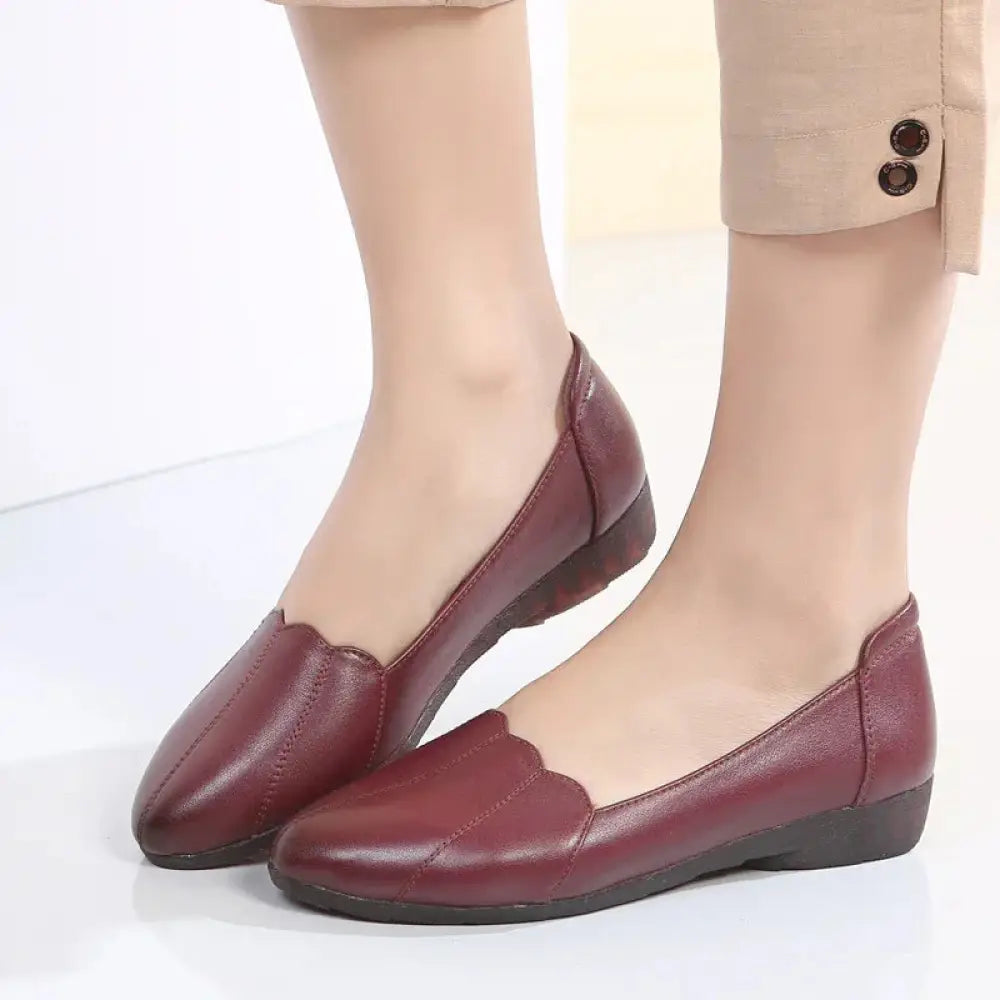 Burgundy leather loafers with scalloped toe and low heel complement scalloped beige leather flats with cushioned soles