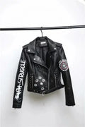 Black faux leather biker jacket with white studded details and embroidered patches including struggle and star emblem