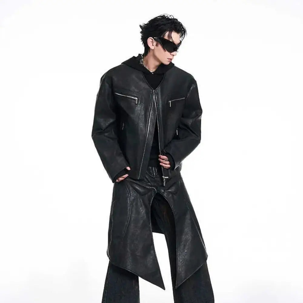 Men’s black leather trench coat with asymmetrical hem and front zipper pockets in slim fit design