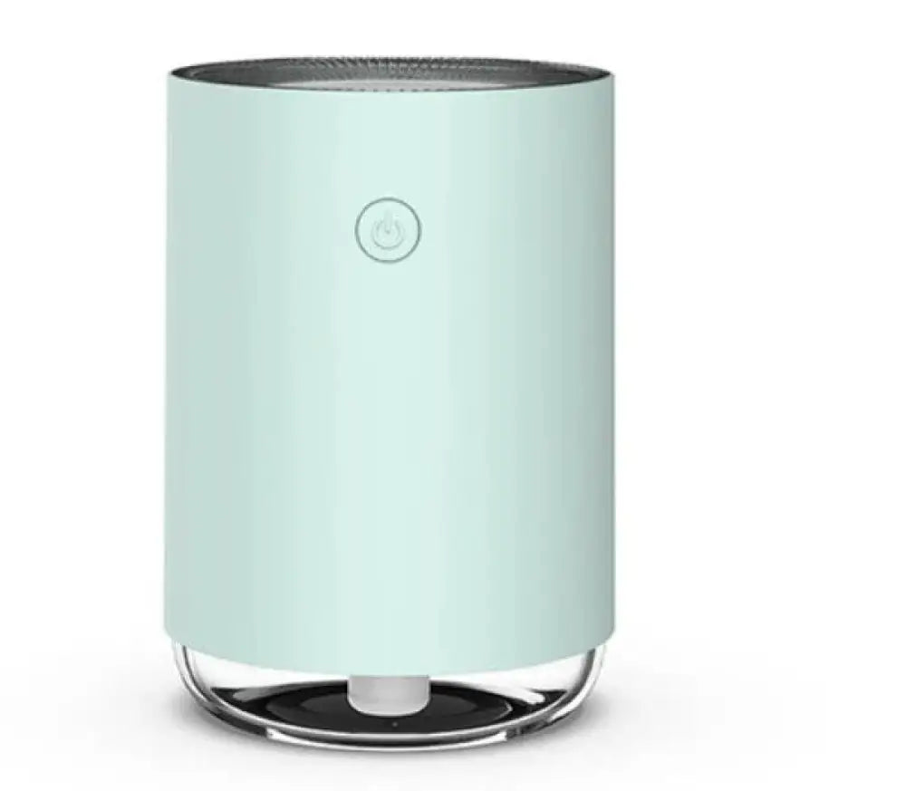 A sleek mint green modern 3-in-1 led night light and essential oil diffuser with a clear glass base and front power button