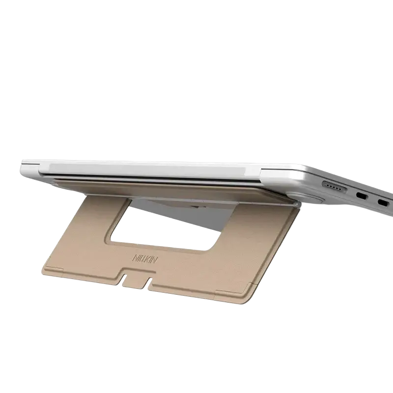 Gold-colored foldable nillkin dualwing adhesive laptop stand with minimalist design and engraved brand name on base