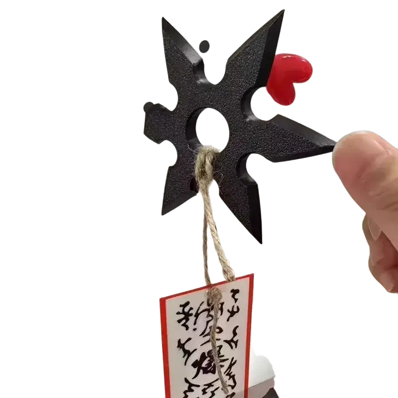Black plastic ninja star shaped pvc shuriken fridge magnet with red heart charm in center for decorative use