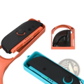 Nintendo Switch 2 sports accessory bundle with orange and teal plastic joy-con grip holders and black controller inserts