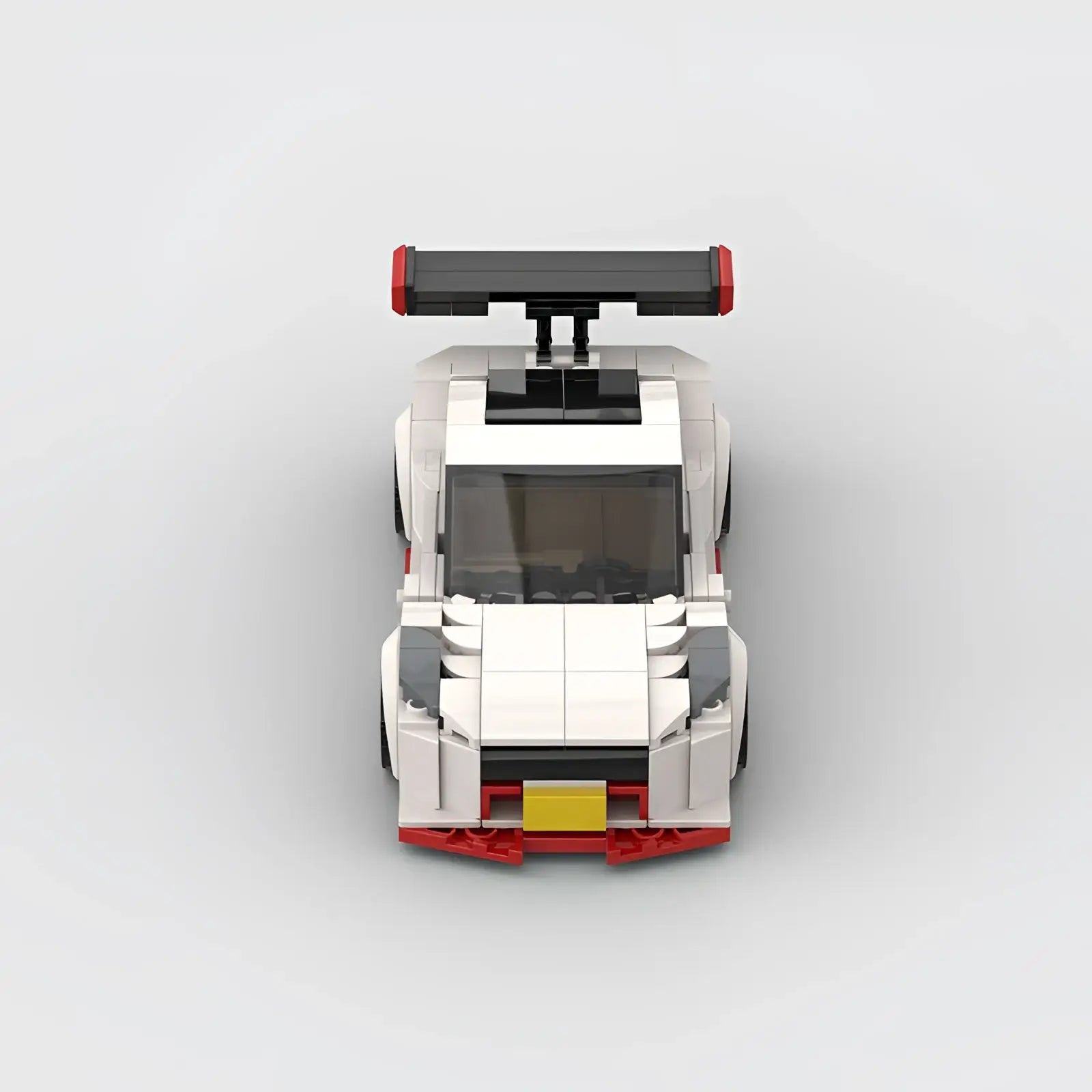Nismo R35 racing car building blocks toy in white and red with black spoiler gray accents and yellow license plate