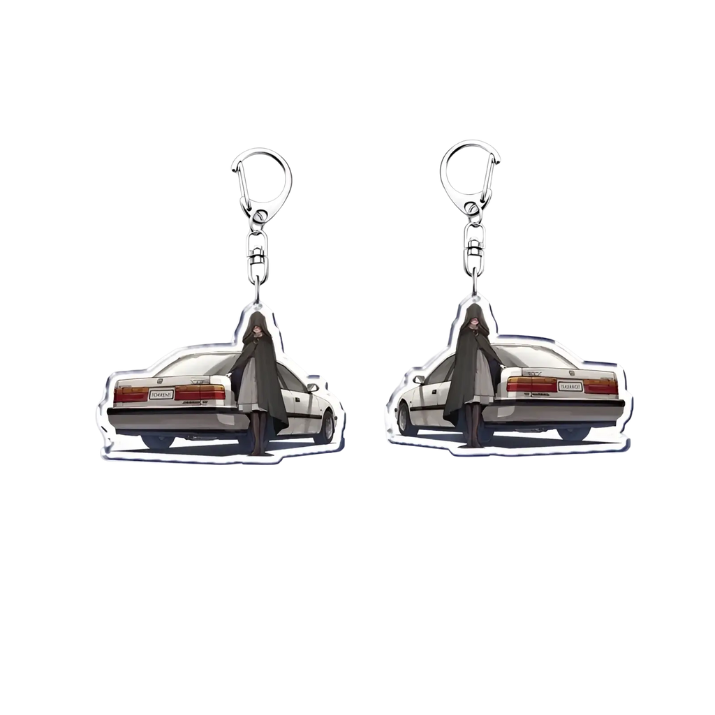 Clear acrylic Nissan Skyline car keychain featuring anime character in dark cloak beside white vintage car with red taillights
