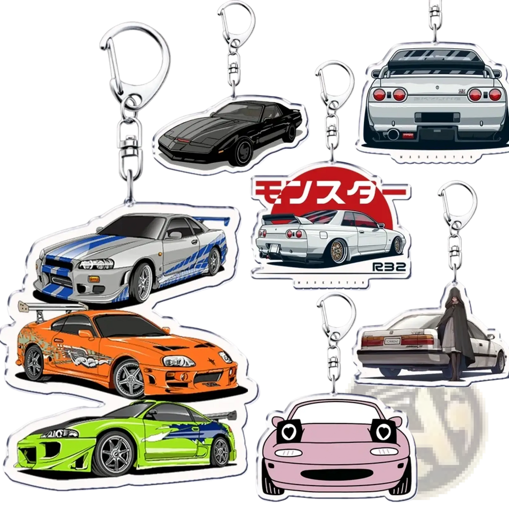 A collection of colorful transparent acrylic keychains featuring iconic fast and furious cars including Nissan Skyline