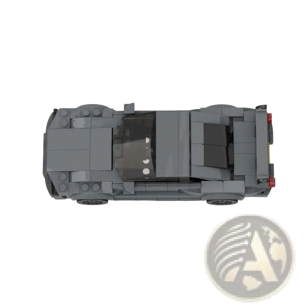 Gray lego nissan skyline r34 gtr sports car model with black translucent roof and red taillights shown from the back
