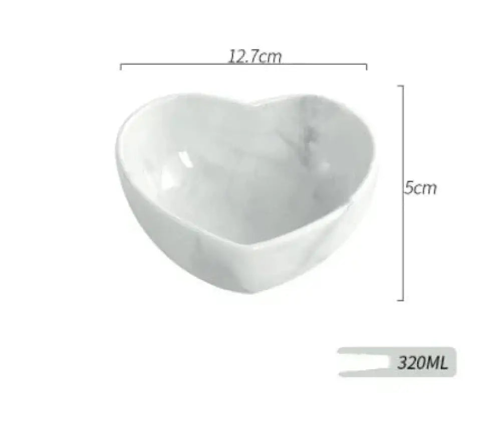 A white ceramic heart-shaped bowl with gray marbling from the Nordic Marbled Heart Ceramic Dinnerware Set