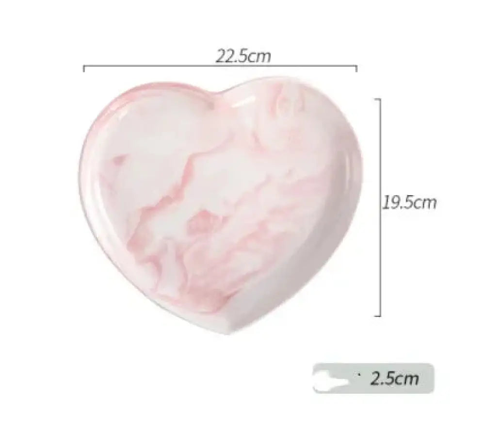 A heart-shaped ceramic dish in soft pink and white marbled pattern from the Nordic Marbled Heart Ceramic Dinnerware Set