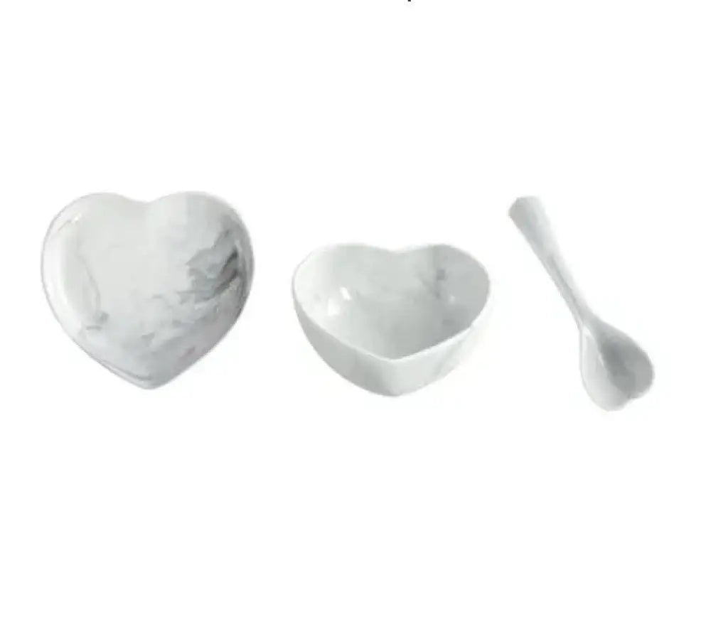 White marble-patterned heart-shaped ceramic bowl set with matching spoon from nordic marbled heart dinnerware set