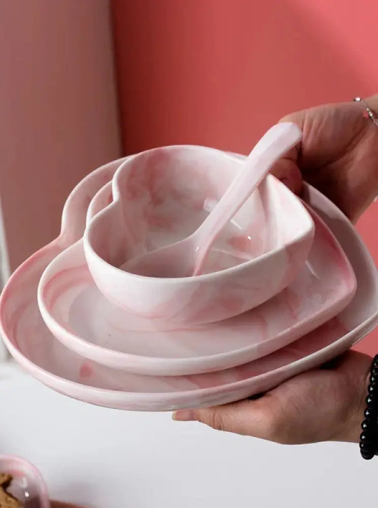 Pink marble-patterned ceramic heart-shaped bowl set with matching spoon from nordic marbled heart dinnerware set
