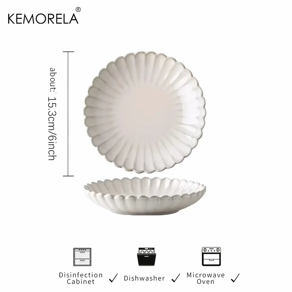 Nordic white ceramic scalloped dinner plate with a petal-like rim and smooth glossy finish
