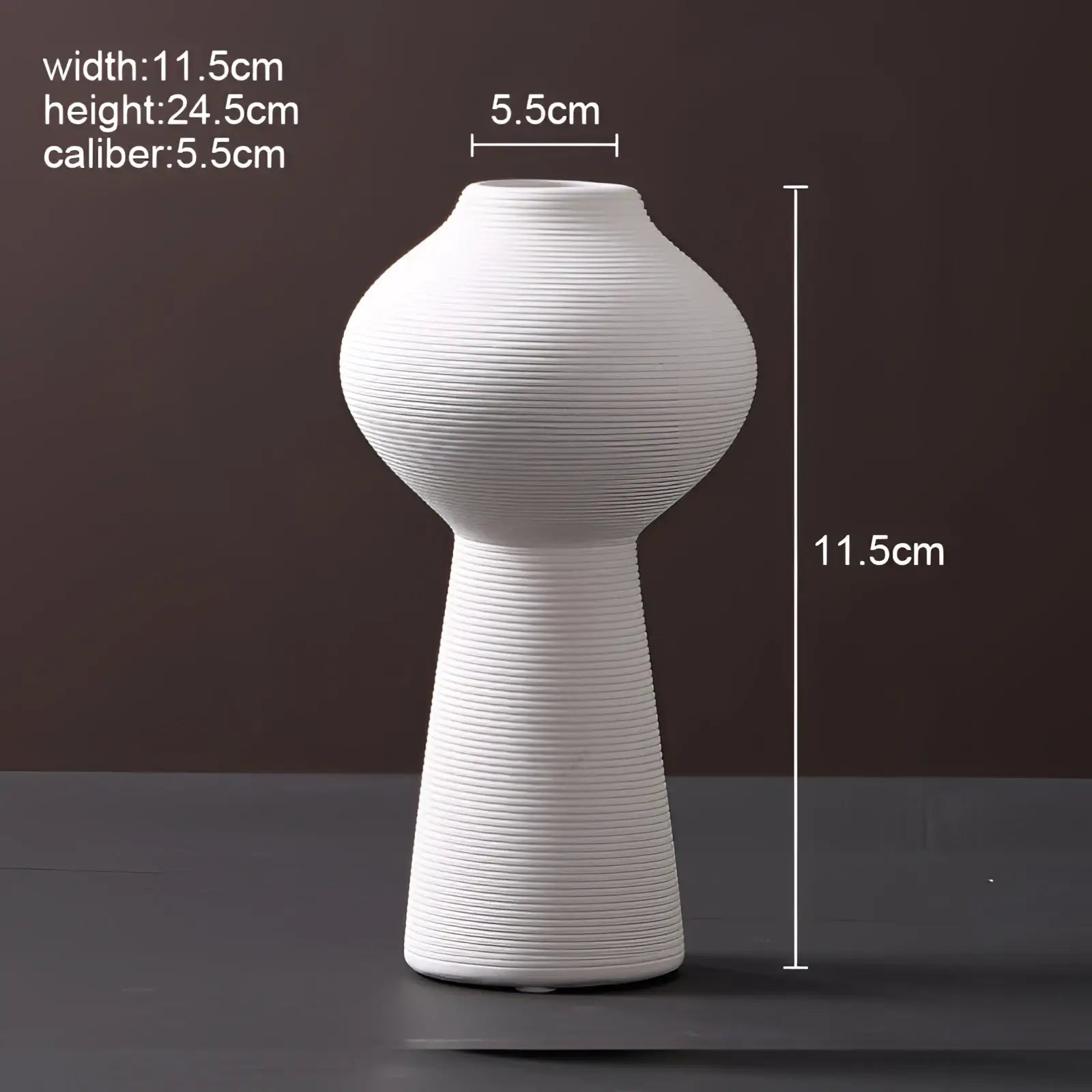 A sleek white ceramic vase with ribbed texture and modern silhouette for nordic home decor