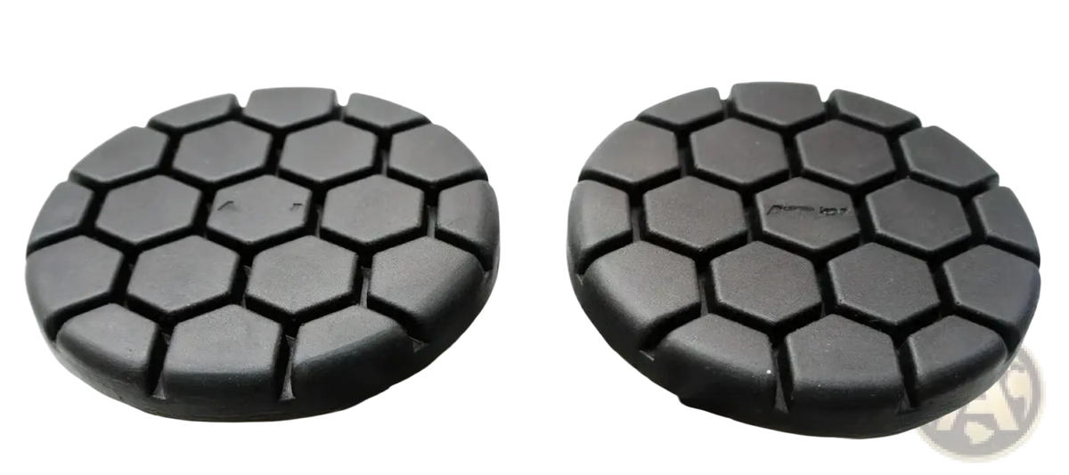 Black hexagonal-patterned polishing pads designed for use with the noseless ergonomic long distance bicycle saddle