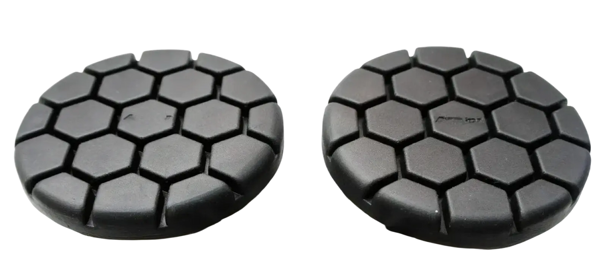 Black hexagonal-patterned polishing pads designed for use with the noseless ergonomic long distance bicycle saddle