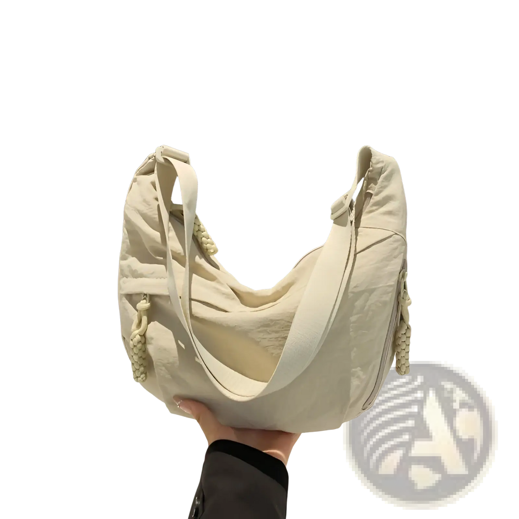 Cream-colored canvas nylon crossbody hobo shoulder bag with large capacity and braided tassel strap details