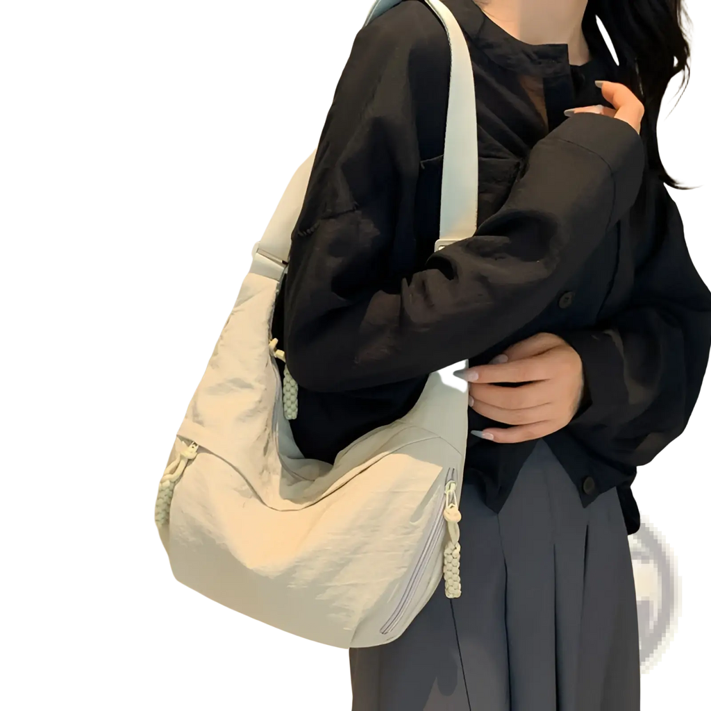 Light gray nylon crossbody bag with braided zipper pulls and matching strap large capacity hobo shoulder bag