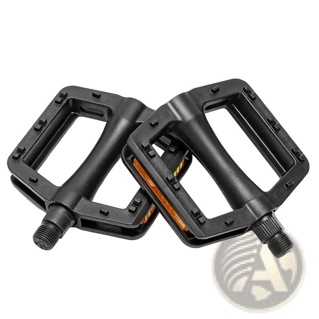 Black nylon mountain bike pedals with textured surfaces and orange friction pads with reflectors for safety