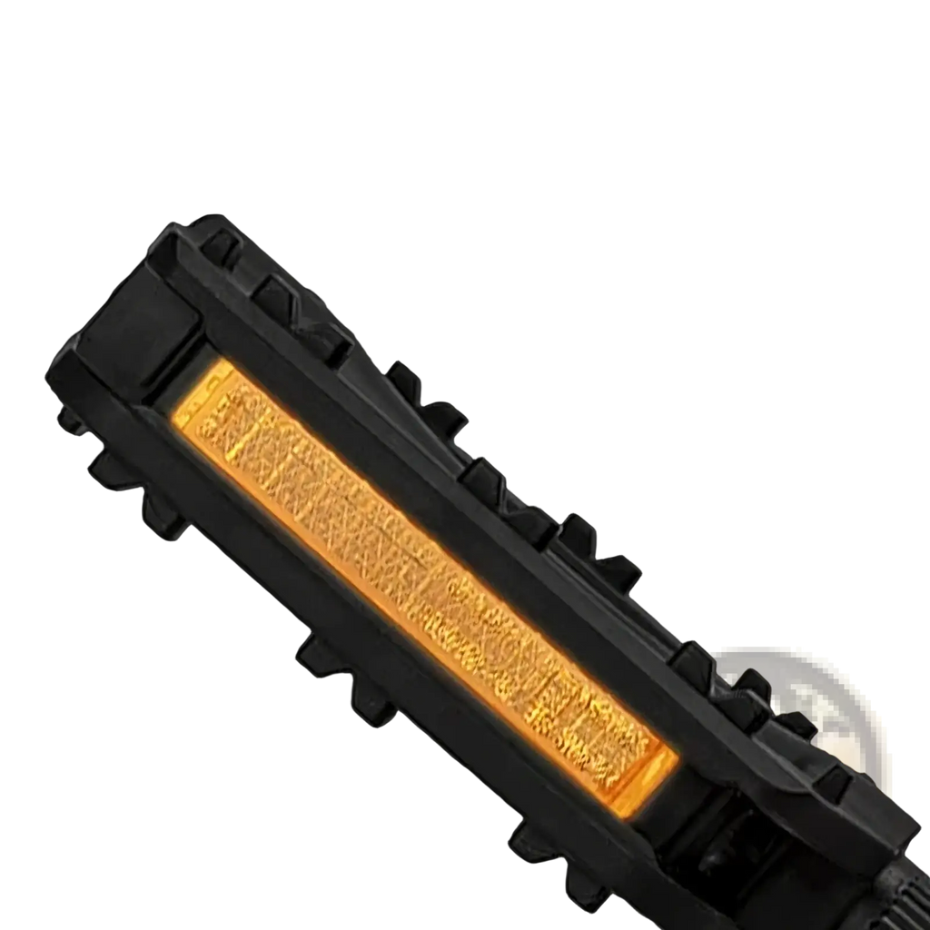 Black nylon mountain bike pedals with black tactical led light bar and glowing amber reflective strip on the back side