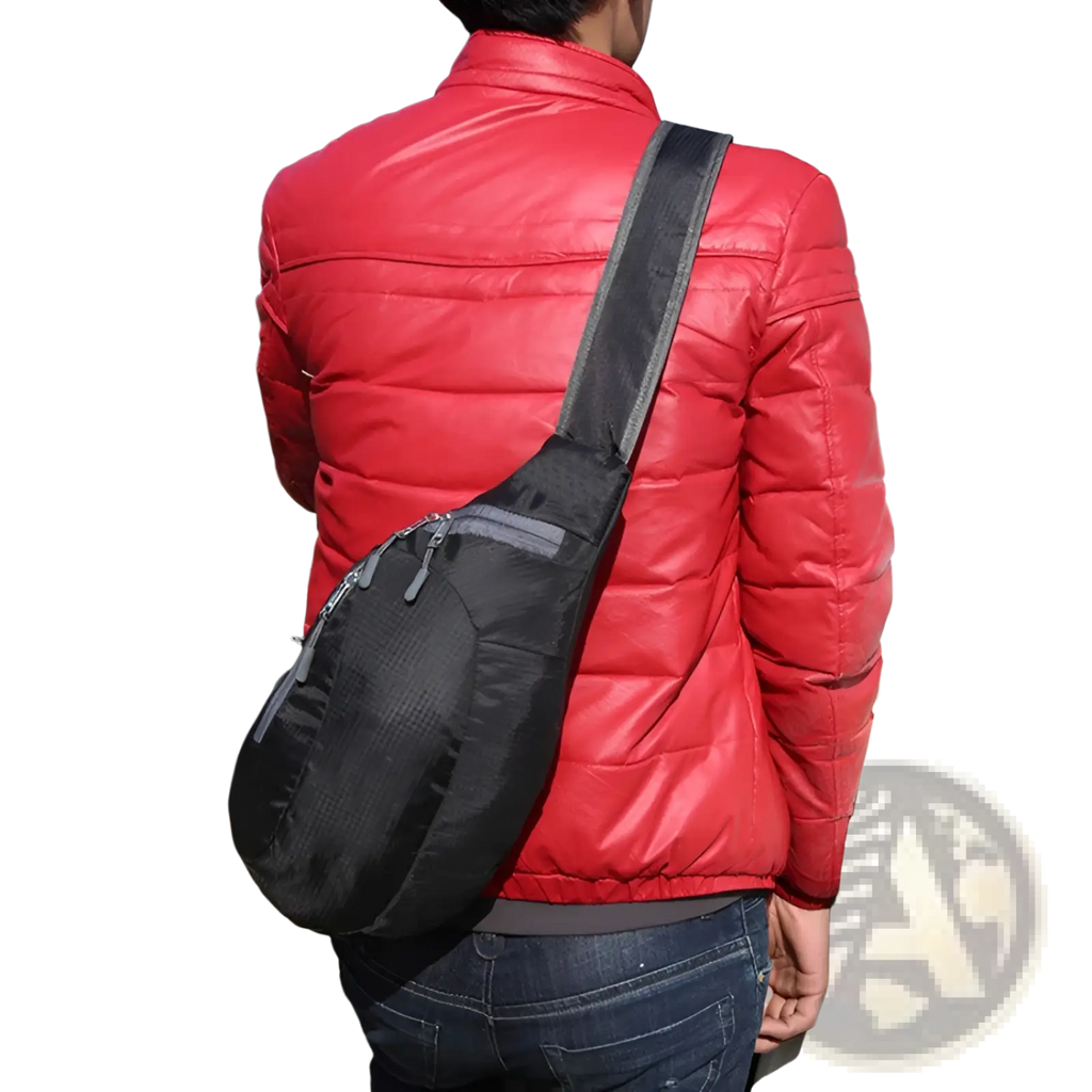 Black nylon sling bag with gray zipper accents and padded shoulder strap for waterproof crossbody use