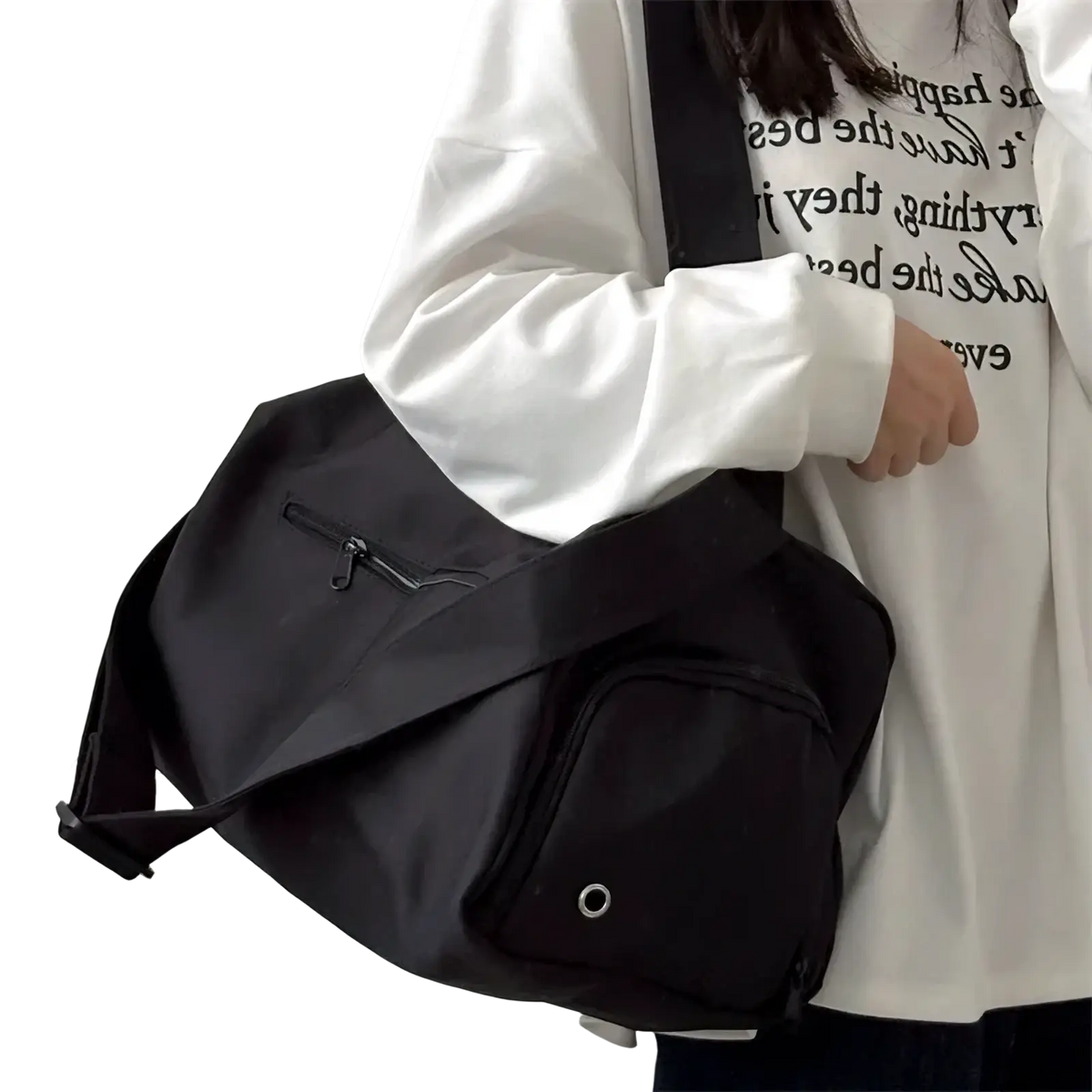 Black nylon travel tote bag with front zippered pocket and circular metal eyelet for casual shoulder use
