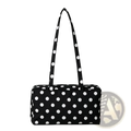 Black and white polka dot nylon travel tote bag with large capacity and zippered closure with matching handles