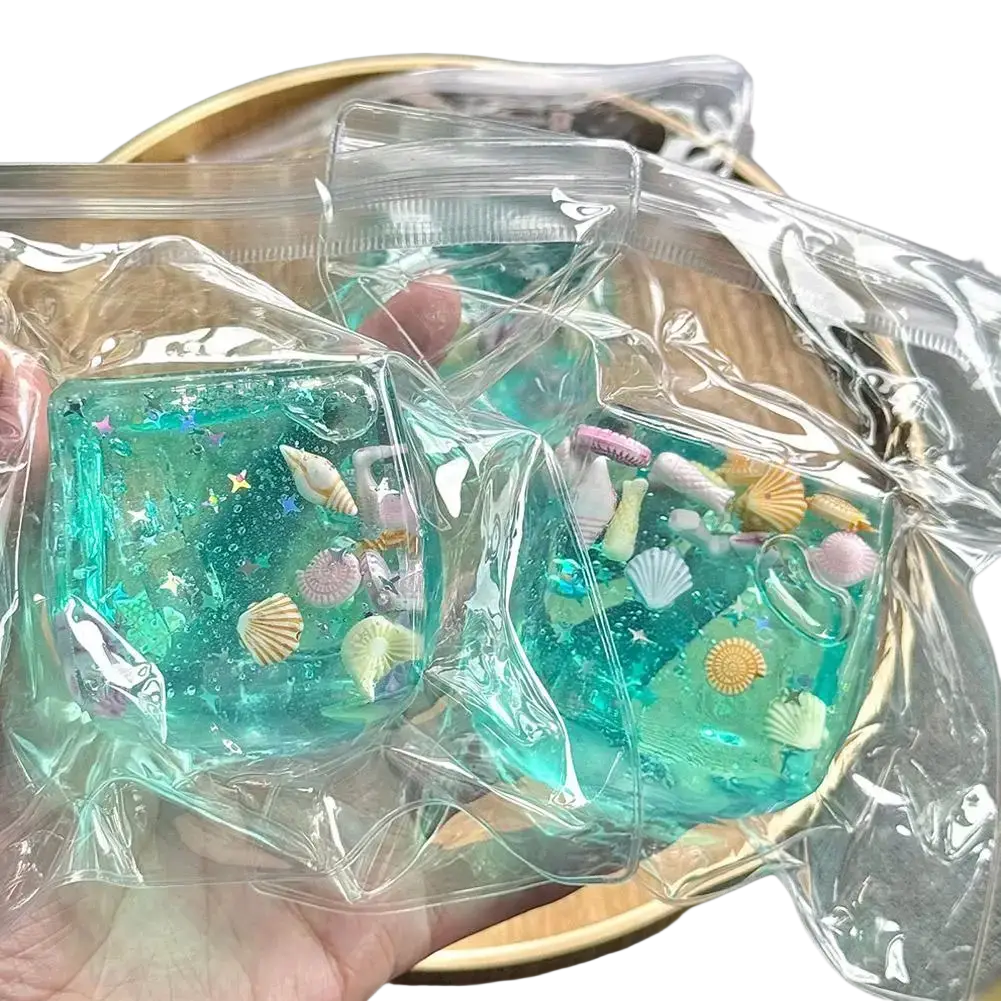 Teal-colored translucent resin ocean sensory fidget cubes in clear plastic bags as a thoughtful gift option