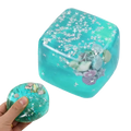 A translucent turquoise cube-shaped ocean sensory fidget cube filled with silver stars and seashells thoughtful gift