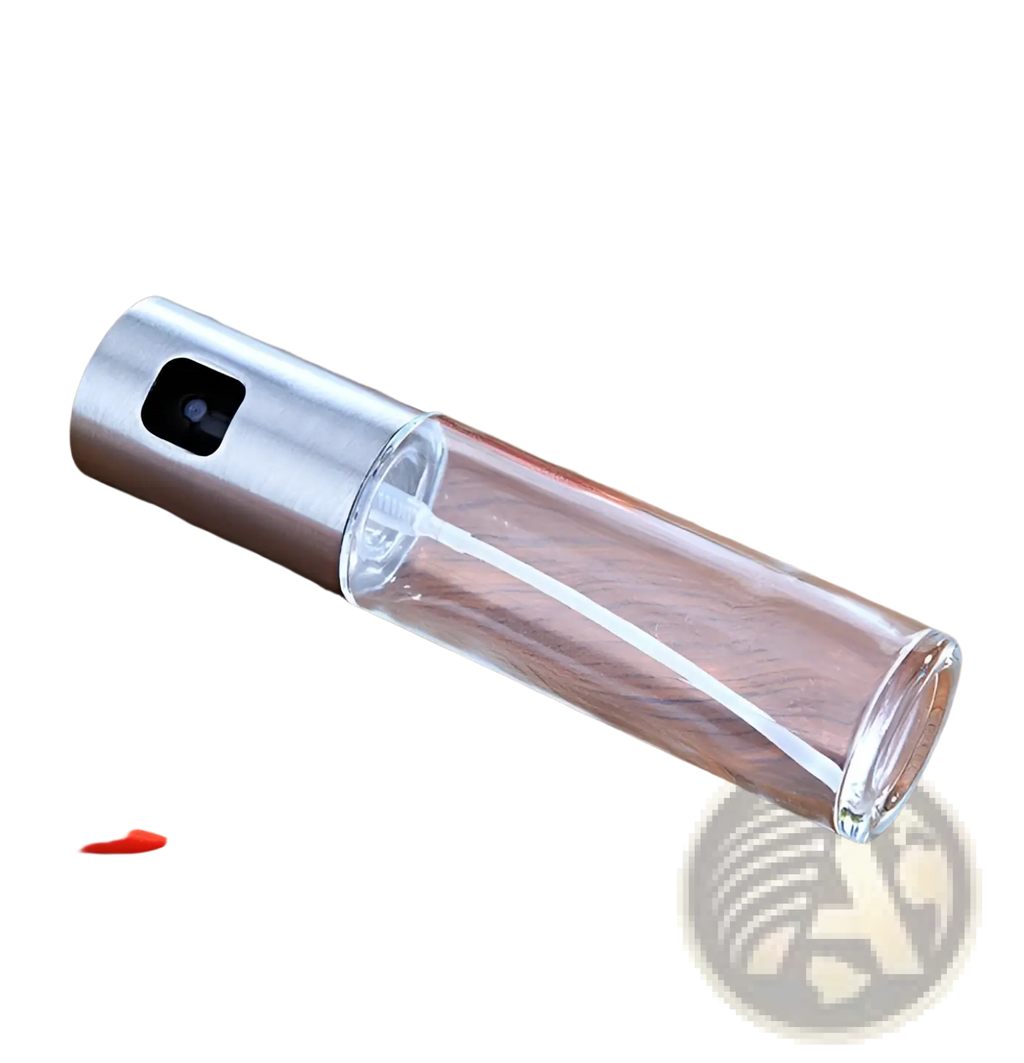 Clear glass oil spray bottle with leakproof design, sleek silver metal nozzle, and black trigger for cooking use