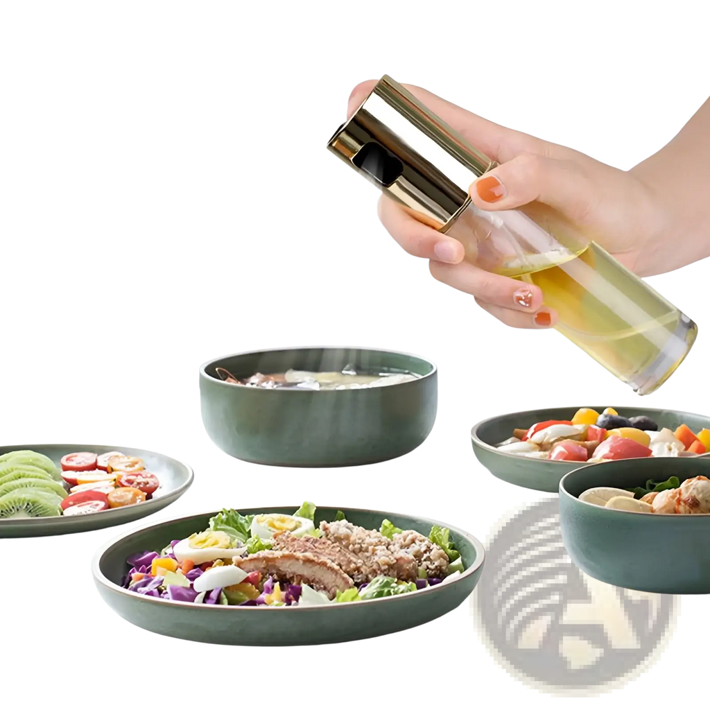 Gold-toned oil spray bottle with clear glass body filled with yellow liquid leakproof glass sprayer for cooking
