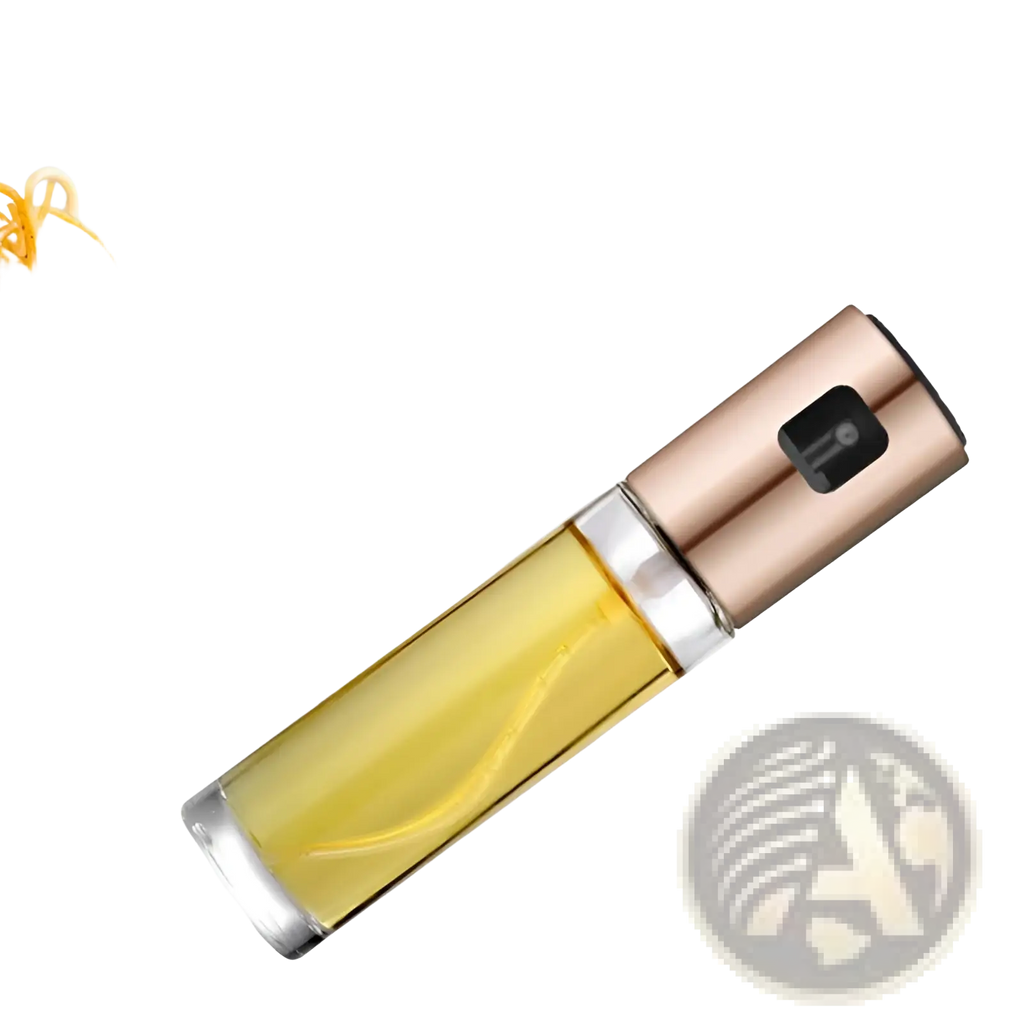 A sleek rose gold oil spray bottle with a clear glass body leakproof for cooking filled with golden olive oil