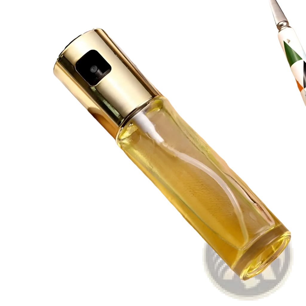 Gold-toned oil spray bottle with clear glass body filled with yellow liquid leakproof cooking sprayer