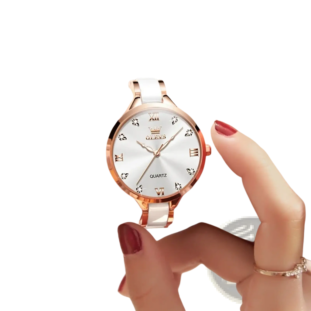 A delicate white ceramic and rose gold olevs quartz women watch with silver dial roman numerals and crystal accents