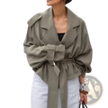 Olive green cropped belted trench coat jacket featuring wide lapels and voluminous sleeves in lightweight fabric