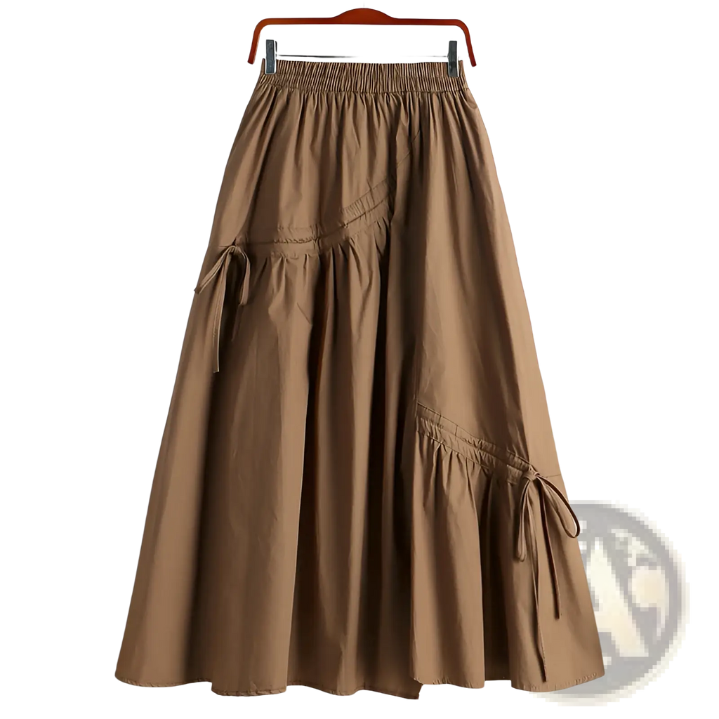 A tan a-line skirt with elastic waistband and side drawstring ties suitable for casual wear