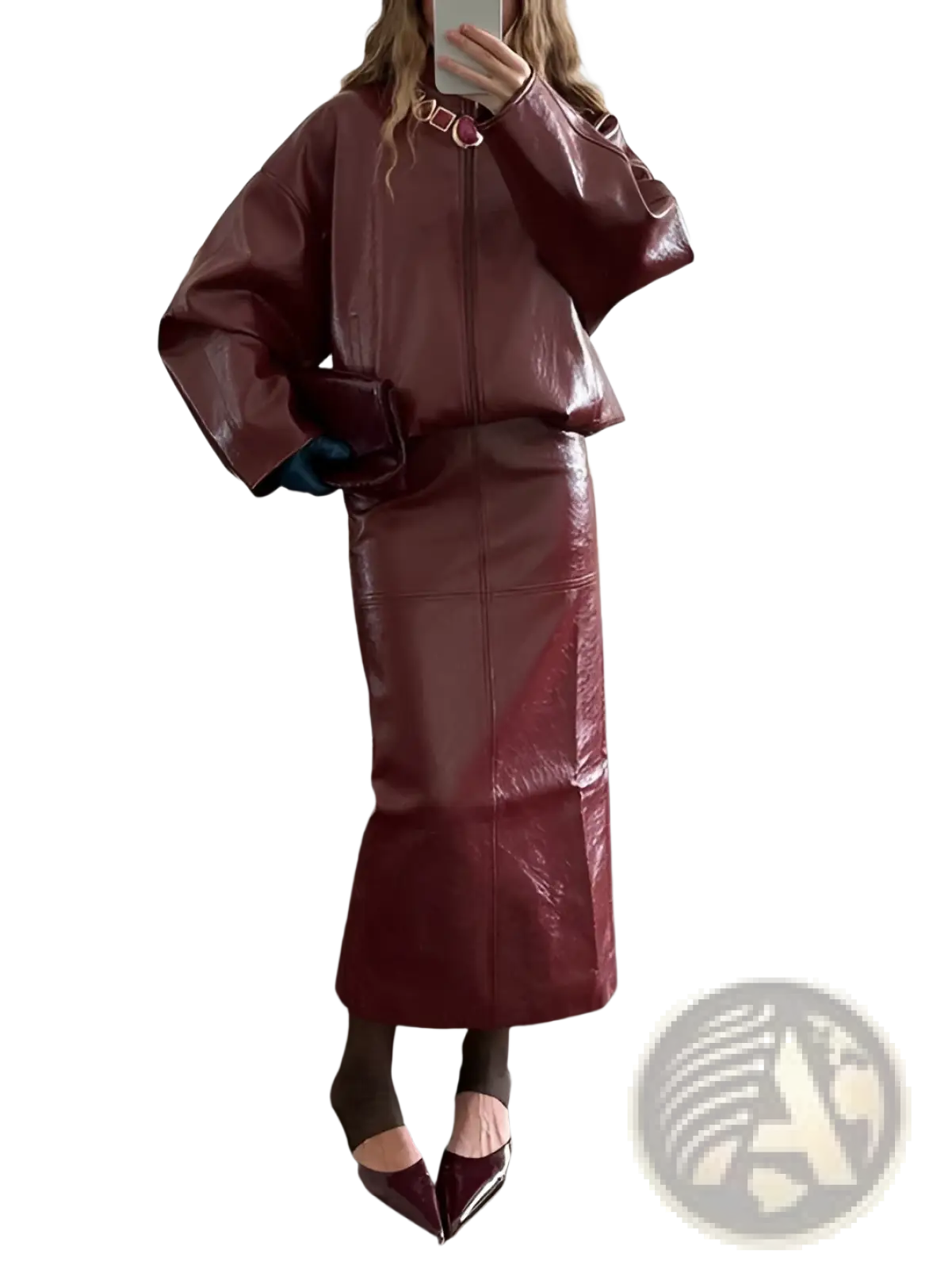 A glossy burgundy faux leather two-piece outfit featuring a cropped jacket with wide sleeves and a high-waisted skirt
