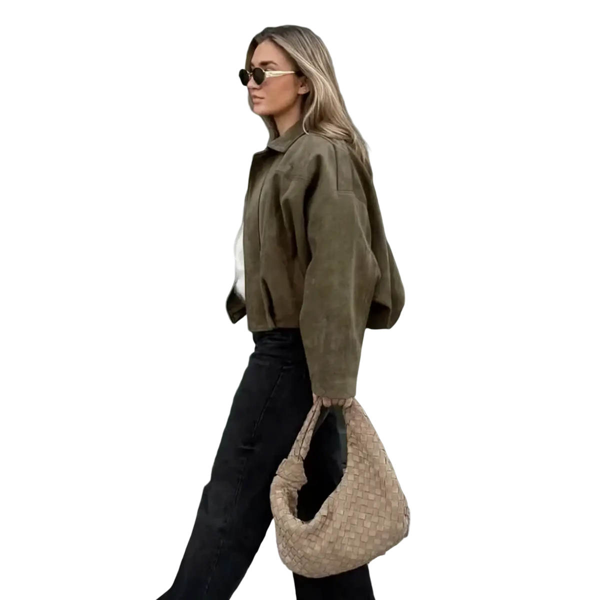 Beige woven wicker handbag with distinctive knot handle paired with olive green suede bomber jacket